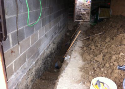 internal french drain system being installed